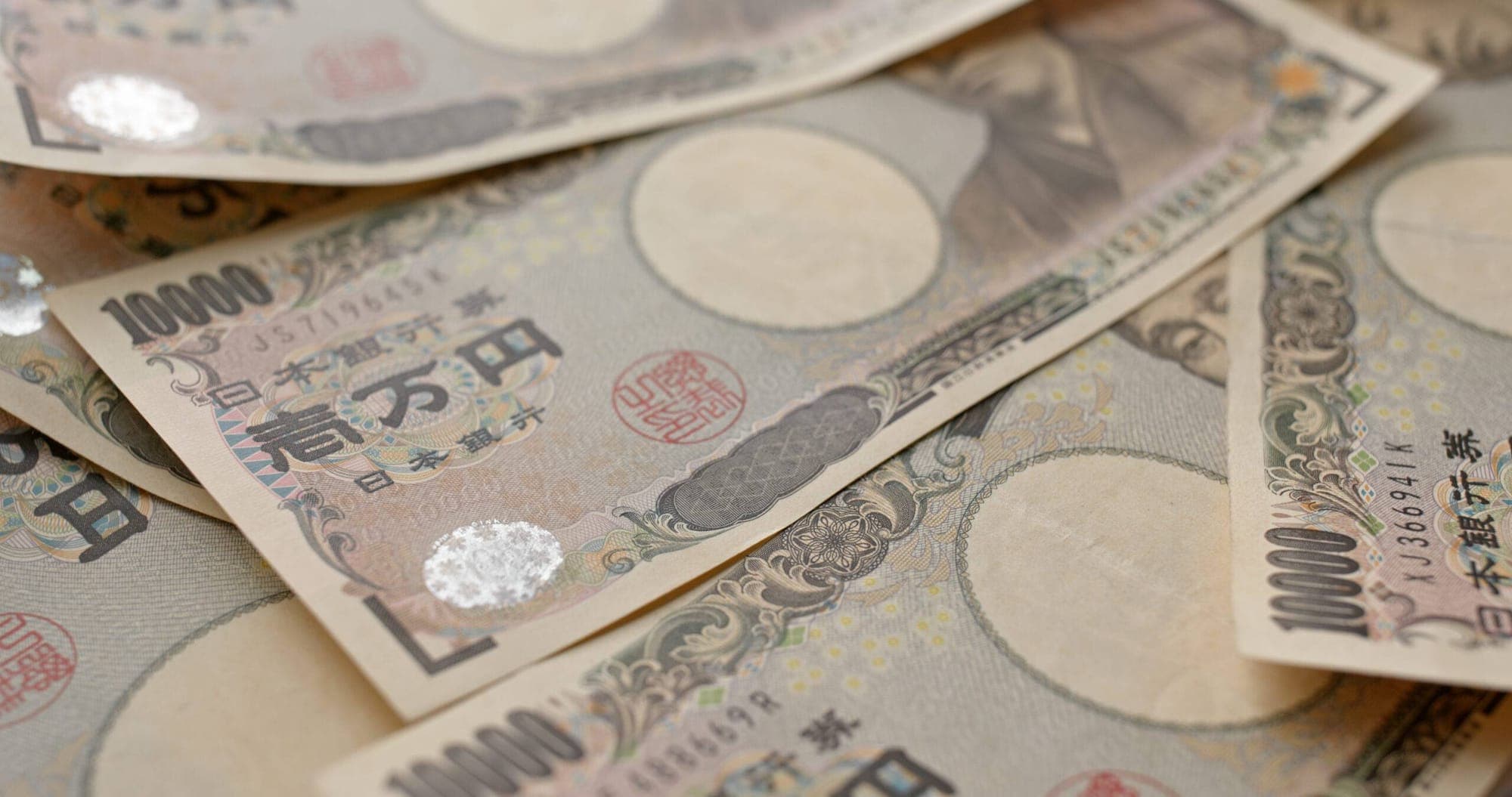 Japanese Yen's Decline Against US Dollar represented in an image.