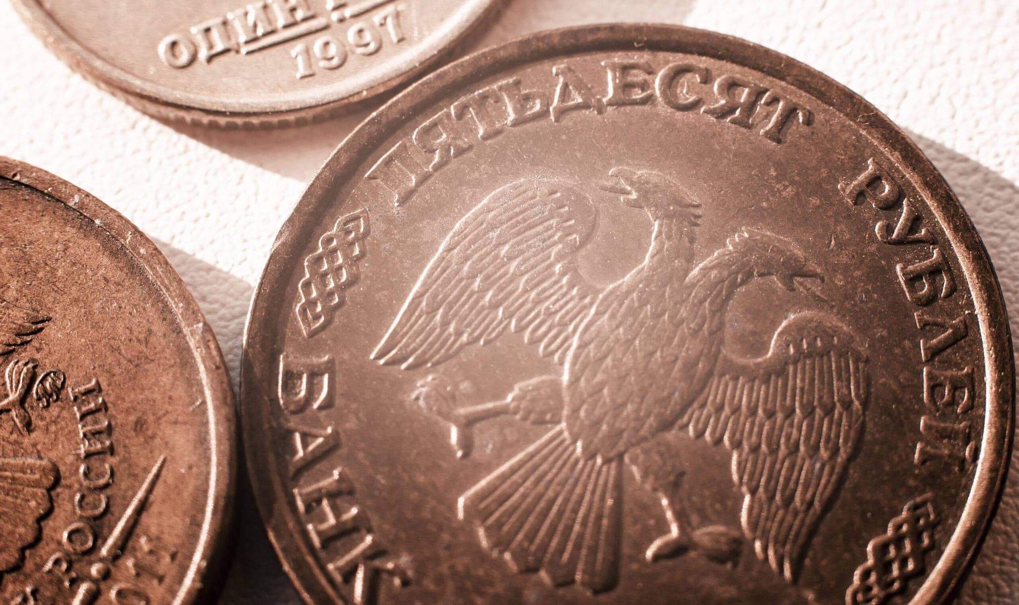 Rouble weakening against Dollar represented in an image.
