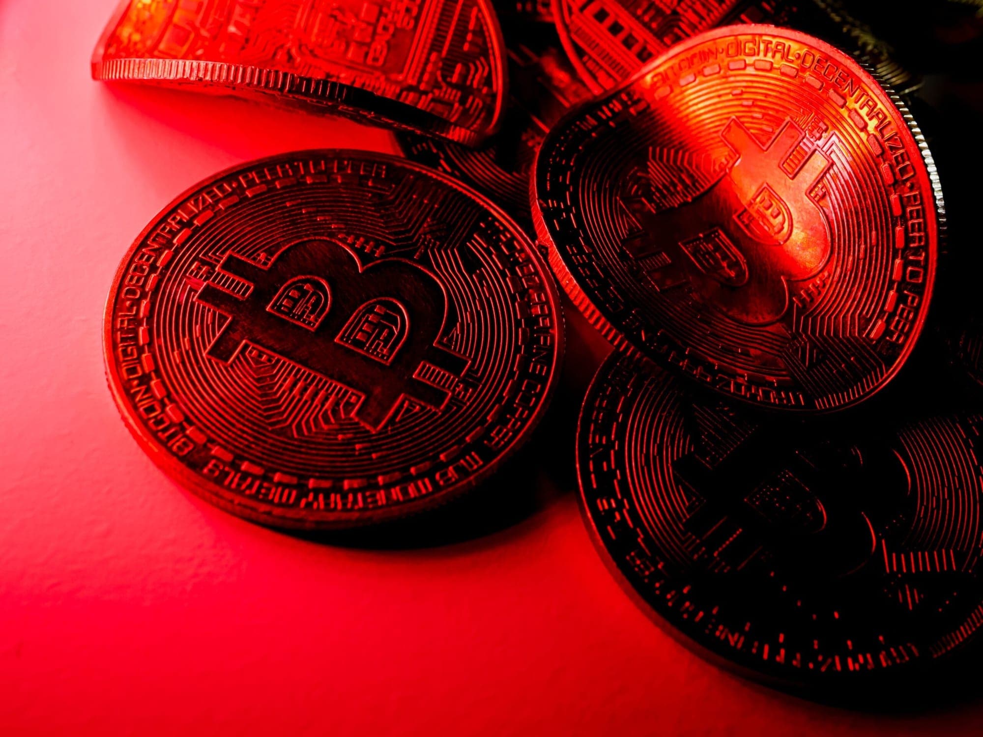 Bitcoin prices slip after SEC charges Binance and Coinbase represented in a picture.