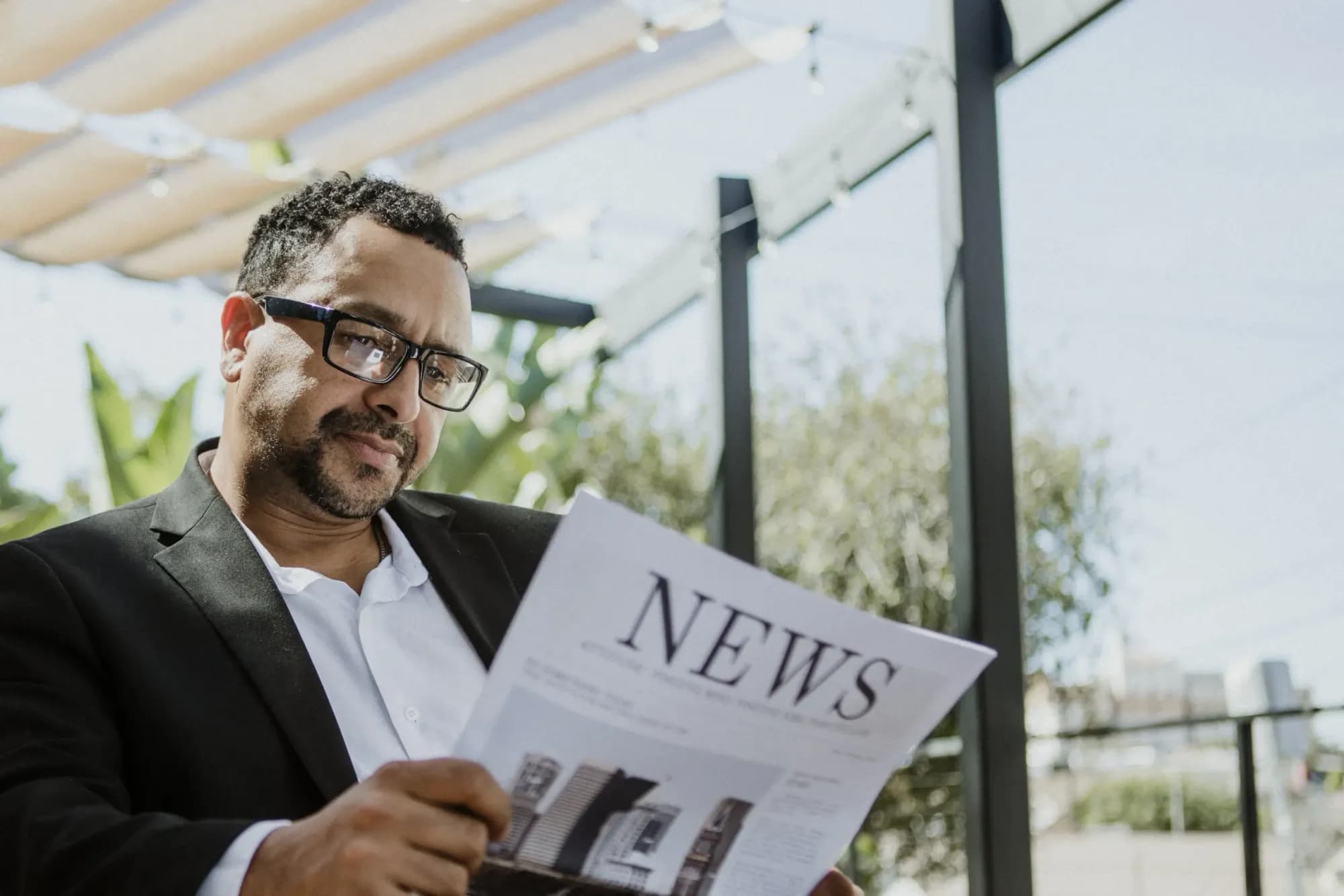 man-reading-the-news-2025-02-09-22-55-46-utc-min