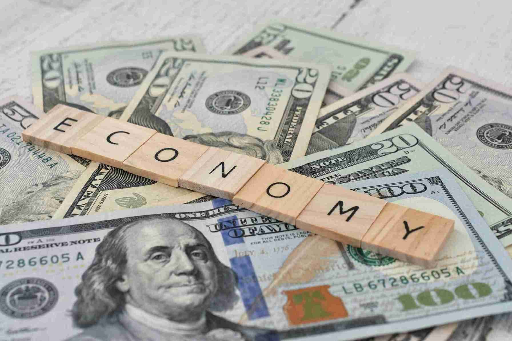 the-word-economy-spelled-out-in-wooden-letter-tile-2023-11-27-05-08-18-utc-min-scaled-1_11zon