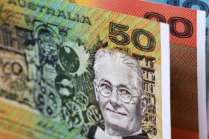Australian Dollar Weakens represented in a picture.